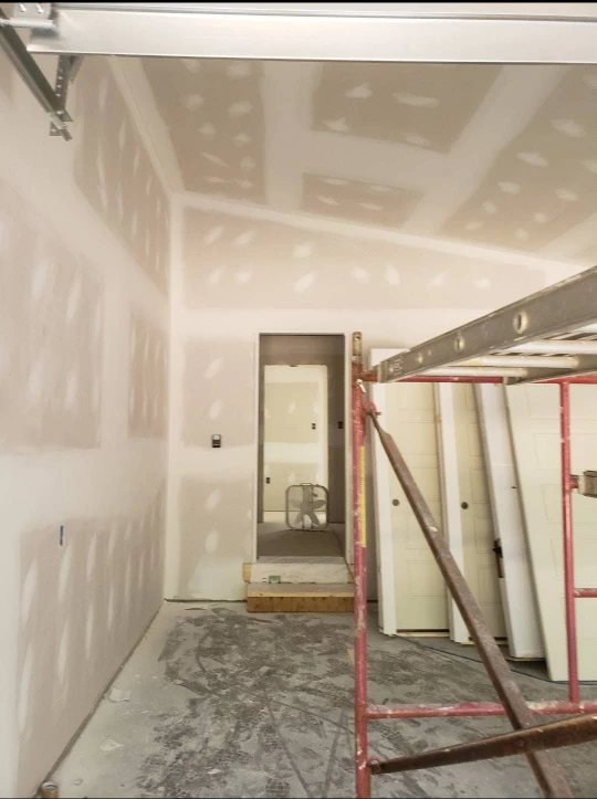 Drywall repair and interior painting work in a home
