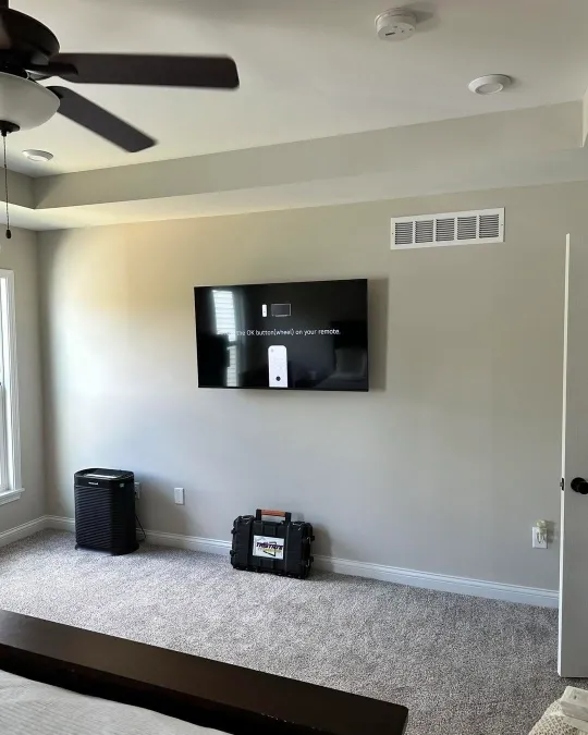 After TV wall mounting in Green Bay – flat screen TV securely mounted on a living room wall