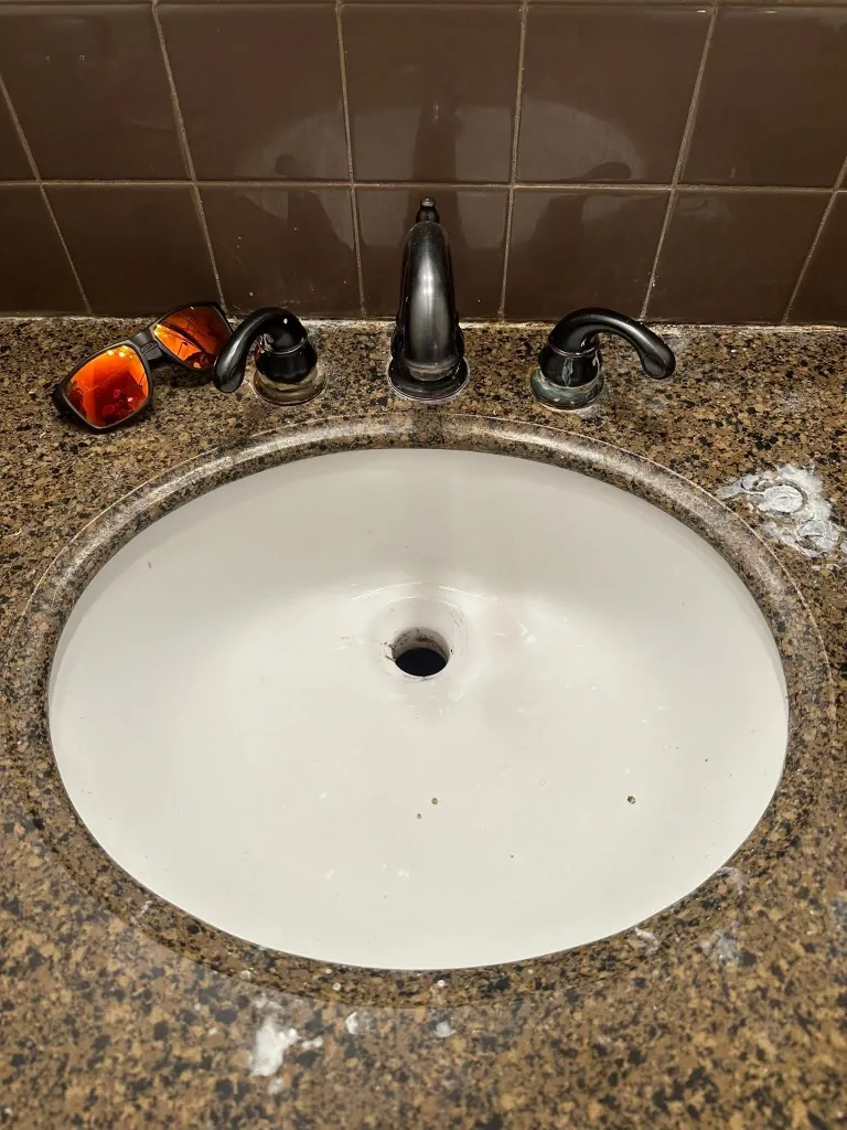 Before bathroom faucet installation in Green Bay – worn-out bathroom vanity faucet