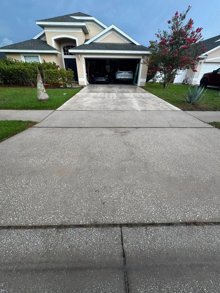 After concrete driveway pressure washing in Green Bay – clean, refreshed concrete driveway