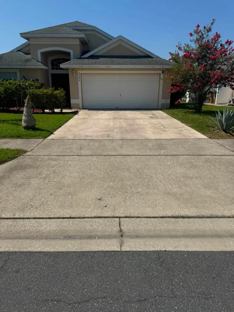 Before concrete driveway pressure washing in Green Bay – stained and dirty concrete driveway