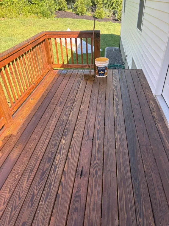 Before deck staining in Green Bay – faded, gray, weathered wood deck