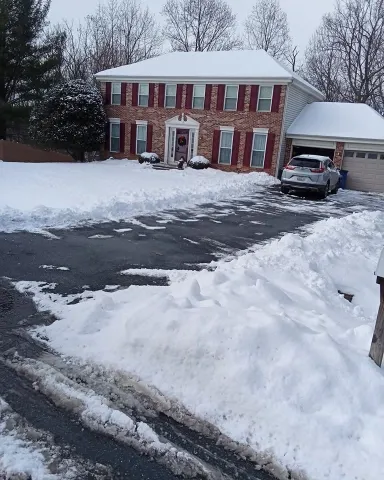 After driveway snow removal in Green Bay – clear, plowed residential driveway