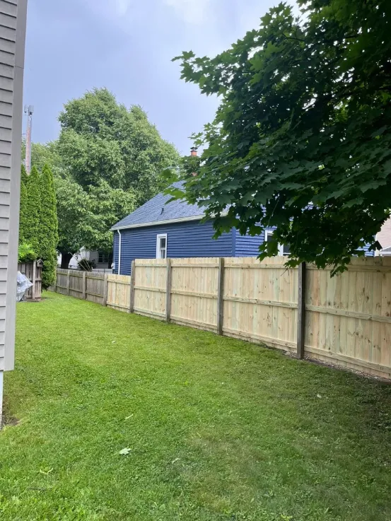 After fence board repair in Green Bay – solid, securely replaced wood fence boards