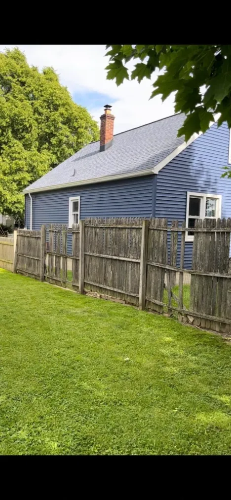 Before fence board repair in Green Bay – broken, cracked or missing wood fence boards
