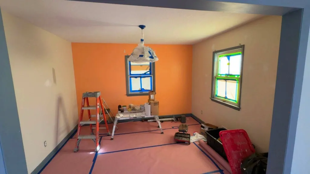 Before interior trim painting in Green Bay – chipped and worn baseboard trim
