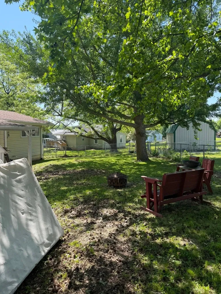 After lawn trimming in Green Bay – crisp, clean lawn edges along driveway and sidewalk
