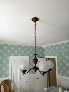Before light fixture replacement in Green Bay – outdated flush-mount ceiling light