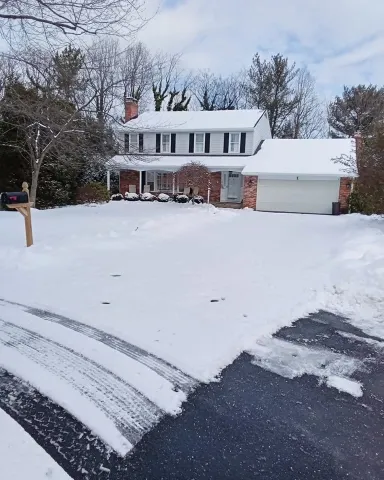 Before sidewalk snow removal in Green Bay – snow-covered front sidewalk and steps